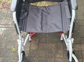 Lightweight Aluminium wheelchair with padded seat and poncho