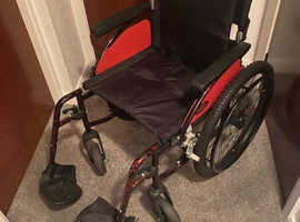 Outlander All Terrain wheelchair with padded cushion, blanket and bag