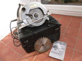 Circular saw in case with spare blade