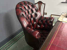 Red leather chair and leather top desk