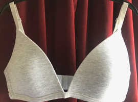 Grey soft bra with adjustable straps.