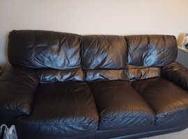 2 x black leather sofas