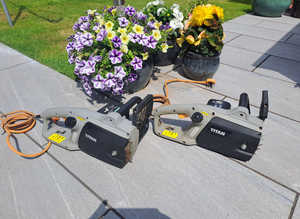Two titan 240v electric chainsaws