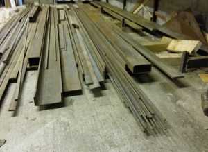 A large quantity of steel different shapes and sizes