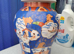 Beautiful Oriental themed tall vase.