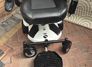 REDUCED 1yr. Old. Rascal Rio. Opens in 3 pices. 17.8 Stone. 10.5 Mls Range Powerchair