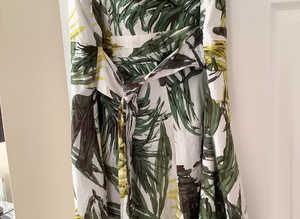 Stunning ladies dress in fresh looking colours, greens, yellow and white,