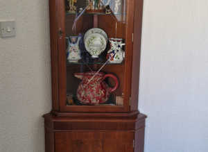 Corner Mahogany display cabinet with bevelled glass door