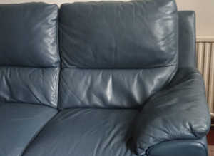 Blue leather two seater sofa and blue leather large storage footstool ex condition as new £400 two sets
