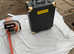 Large case on wheels containing tools, brand-new never used also chainsaw