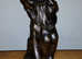 Vintage cold cast bronze of naked lovers entwined.