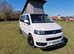 Volkswagen T5 Campervan with trailer, blow-up awning and all accessories.