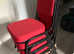 8 times red stackable banqueting chairs
