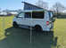 Volkswagen T5 Campervan with trailer, blow-up awning and all accessories.
