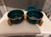 Green, gold ceramic dog food bowls with wooden stand