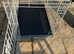 Medium sized dog crate with two doors.