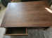 Dark brown oak coffee table with shelf and drawer each side