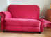 Pair of 2 seater drop arm sofas in raspberry fabric