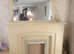 Lovely wooden fireplace with overmantle mirror