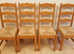 Rustic medium oak sturdy dining table & 4 rush-seat ladder-back sturdy chairs very good quality