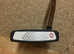 An odyssey triple track putter for sale in excellent condition with cover
