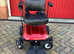 Red electric wheelchair as new