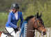 Serious showjumping schoolmistress