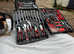 Large case on wheels containing tools, brand-new never used also chainsaw