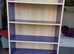 Blue Bookcase With Wood Effect Background
