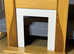 Electric Fire with surrounding wooden fireplace