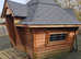 Used garden Arctic log cabin with grill/fire pit & storage