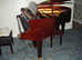 Well cared for modern John Broadwood  & Sons Grand Piano in Beautiful polyester mahogany finish.